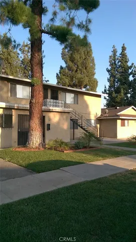 a view of a house with a yard and a lake view