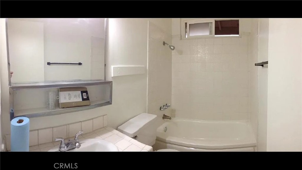 160 West Cascade Drive Rialto, CA 92376 - Photo 19 of 28 a bathroom with a sink and a mirror