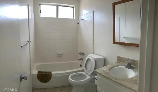 a kitchen with granite countertop a stove and a sink