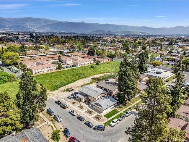 an aerial view of a residential houses and city view
