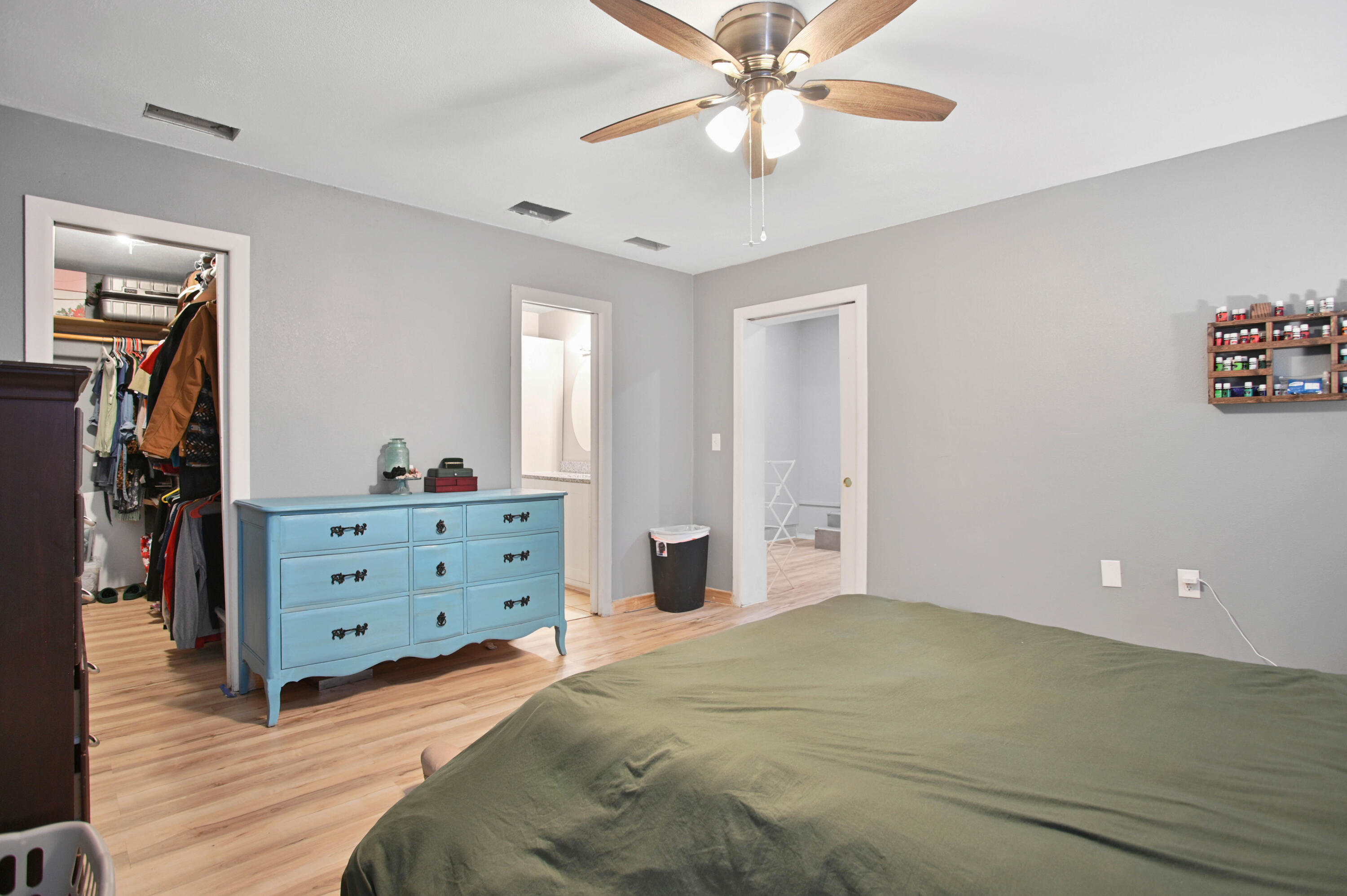 704 4th Street Smyer, TX 79367 - Photo 28 of 38 a bedroom with a bed and a chandelier