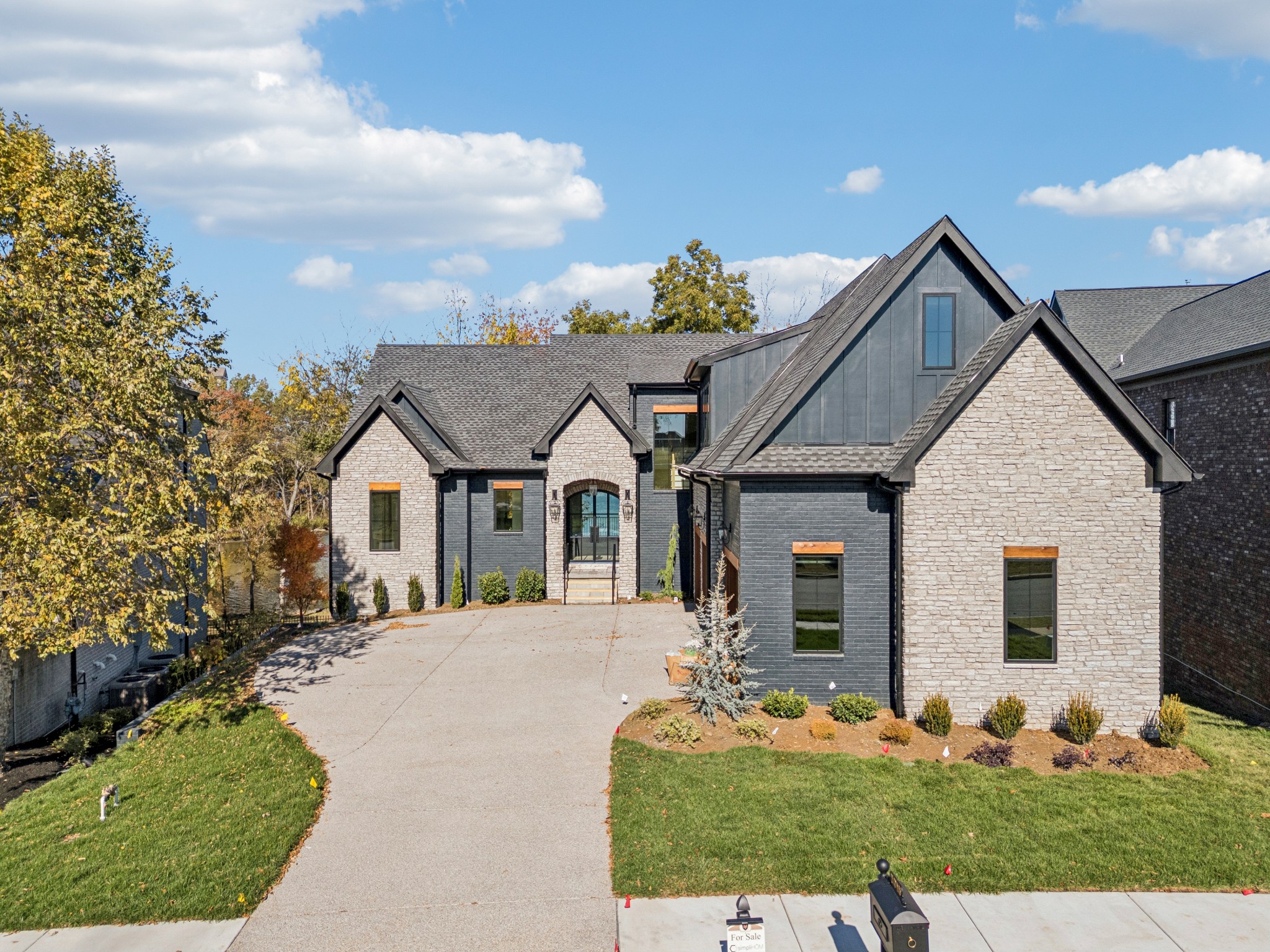 a front view of a house with yard