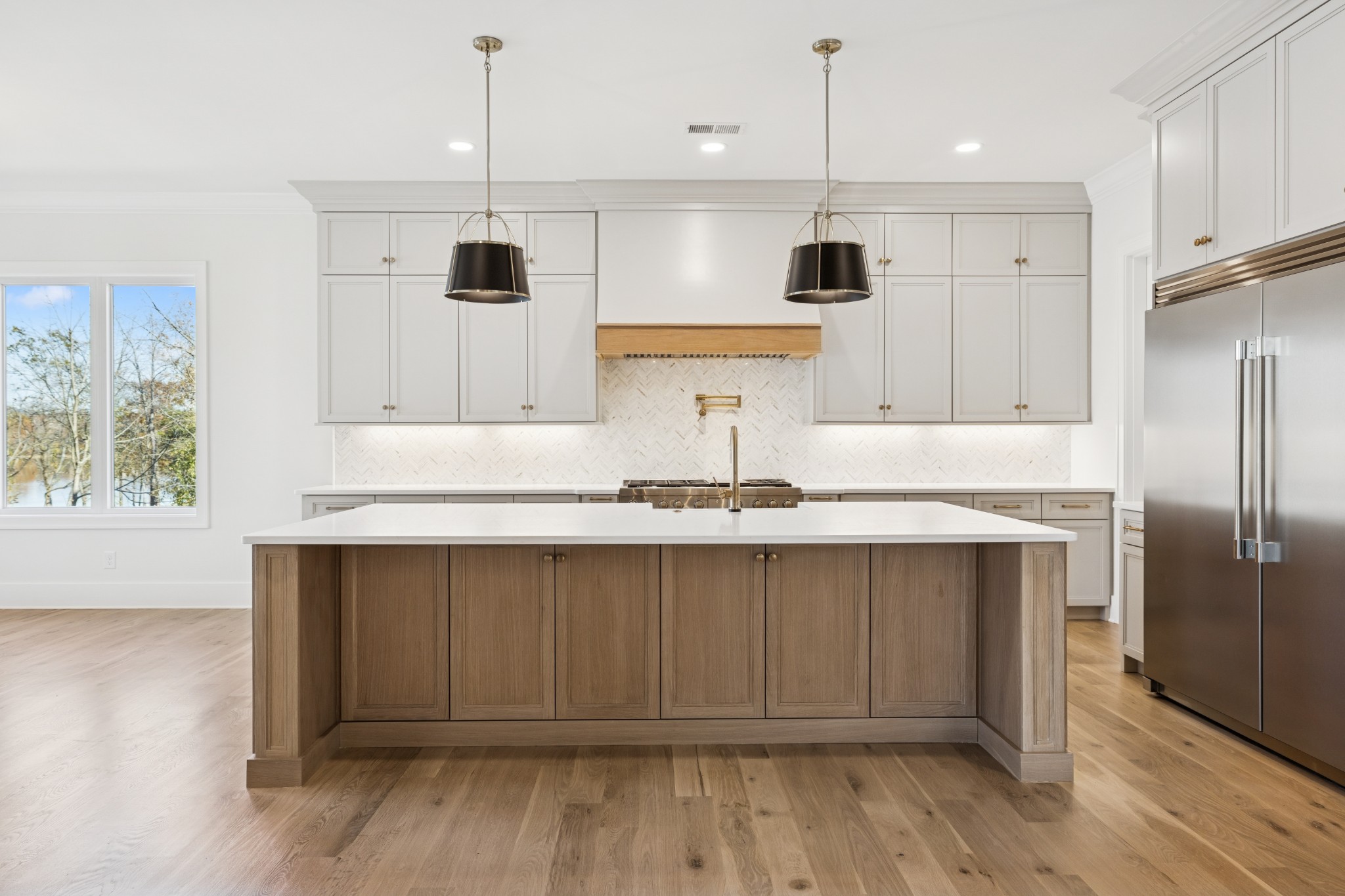 2016 Albatross Way Gallatin, TN 37066 - Photo 34 of 88 a kitchen with stainless steel appliances granite countertop a sink a microwave a refrigerator and wooden cabinets