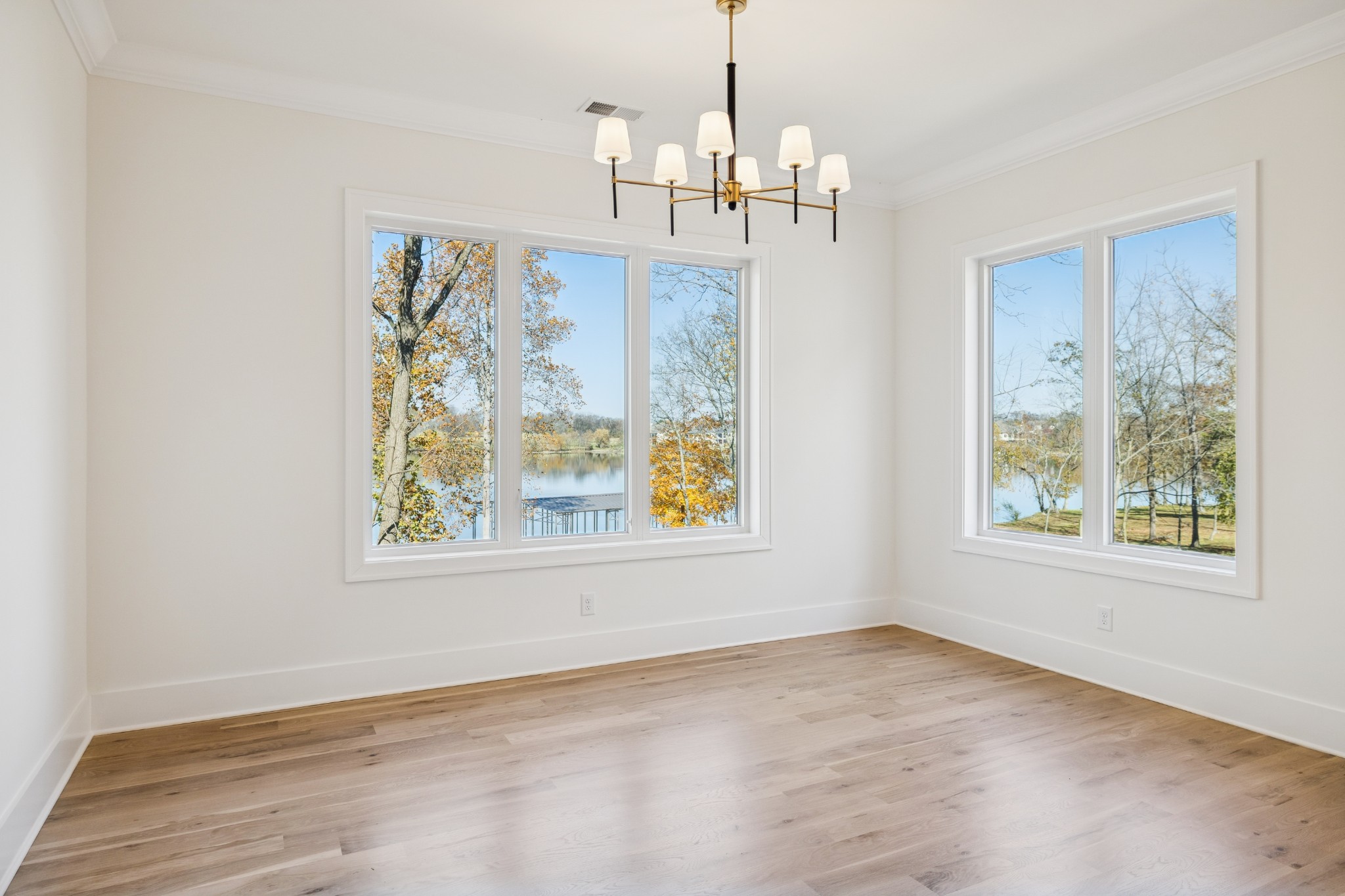 2016 Albatross Way Gallatin, TN 37066 - Photo 39 of 88 an empty room with windows and chandelier