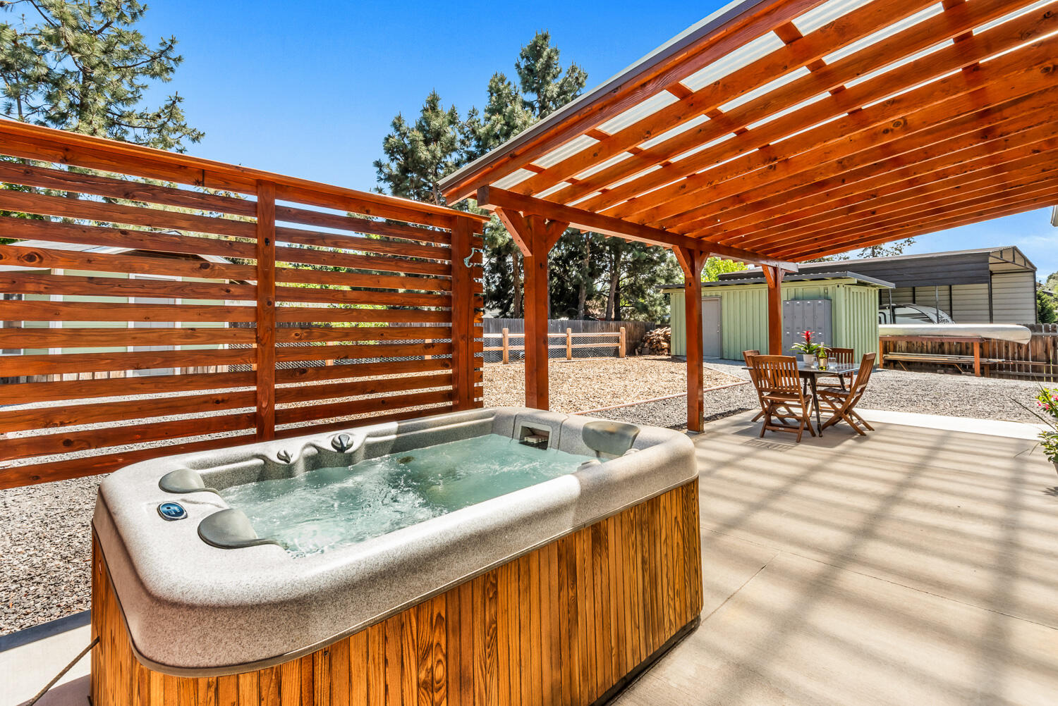 63406 Vogt Road Bend, OR 97701 - Photo 20 of 27 Backyard covered patio with hot tub