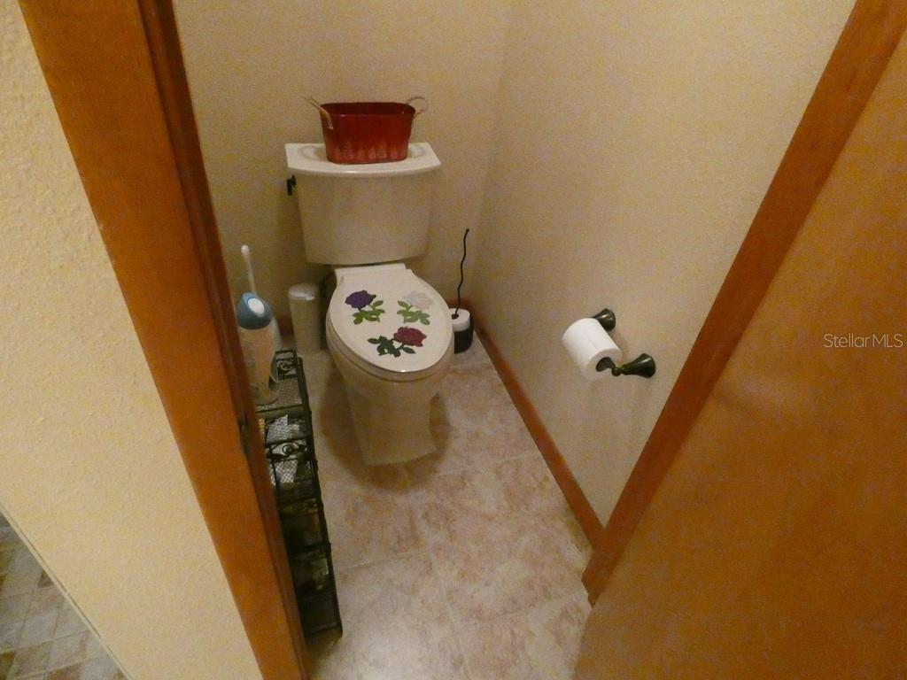 5260 Tuna Lane Weeki Wachee, FL 34607 - Photo 11 of 34 a bathroom with a sink and toilet