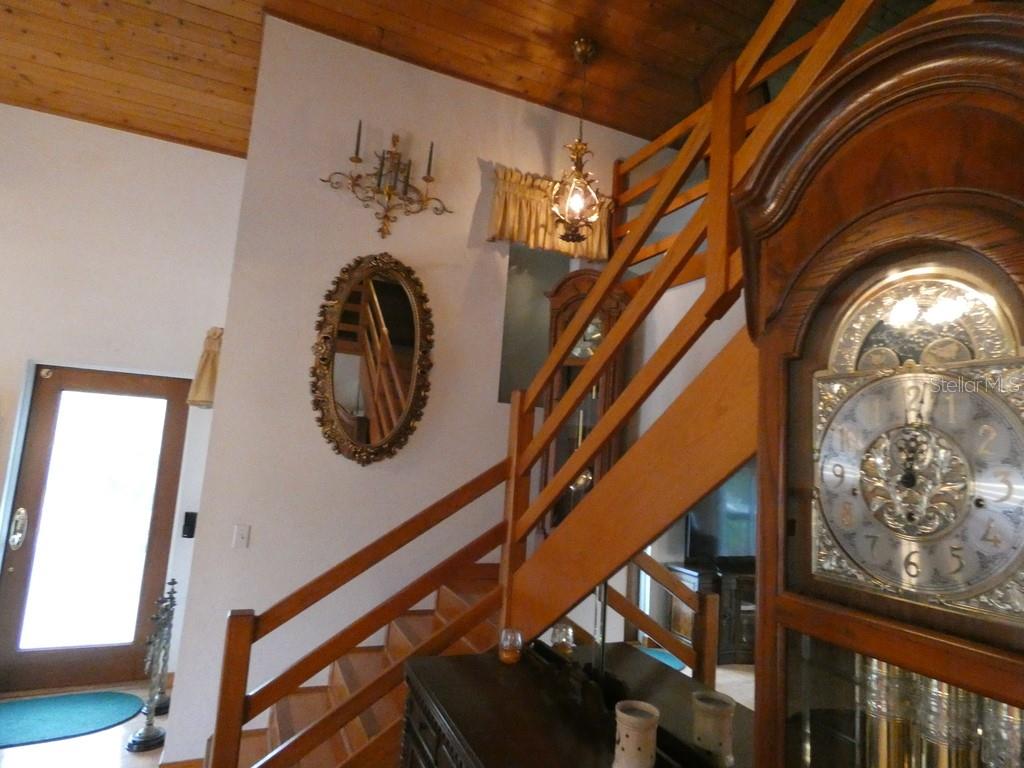 5260 Tuna Lane Weeki Wachee, FL 34607 - Photo 21 of 34 a view of staircase with large window