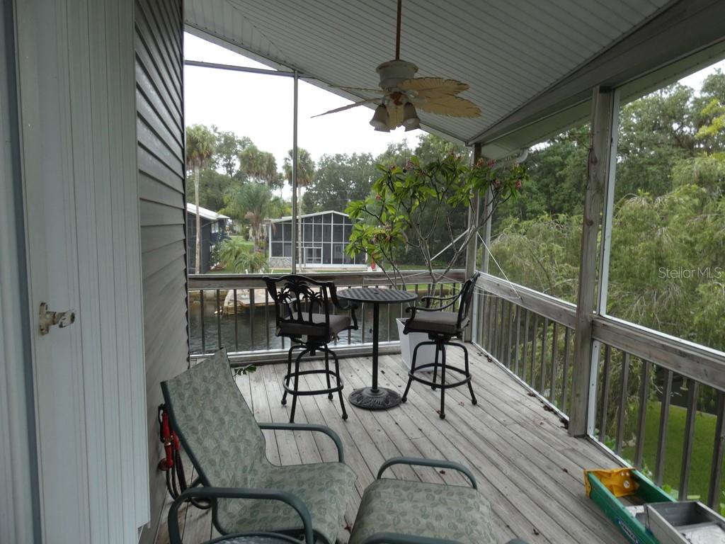 5260 Tuna Lane Weeki Wachee, FL 34607 - Photo 24 of 34 a view of a dining room with furniture window and outside view