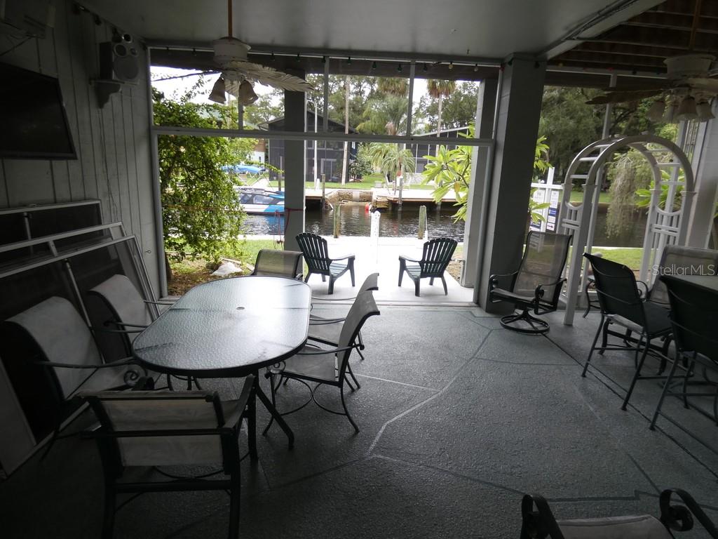 5260 Tuna Lane Weeki Wachee, FL 34607 - Photo 29 of 34 a view of a dining room with furniture window and outside view