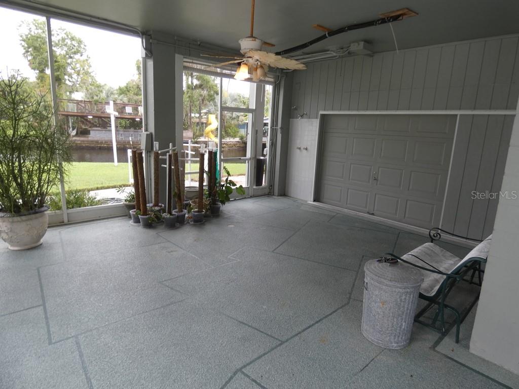5260 Tuna Lane Weeki Wachee, FL 34607 - Photo 33 of 34 a view of a room with gym equipment and a porch