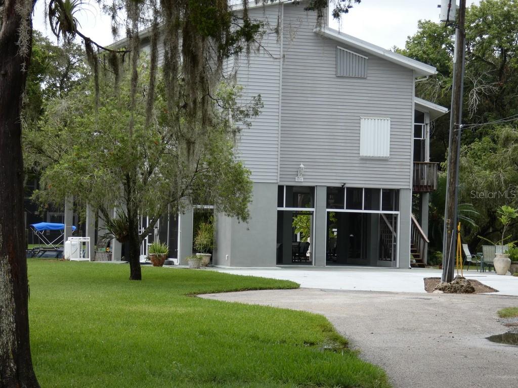 5260 Tuna Lane Weeki Wachee, FL 34607 - Photo 34 of 34 a view of a house with a yard