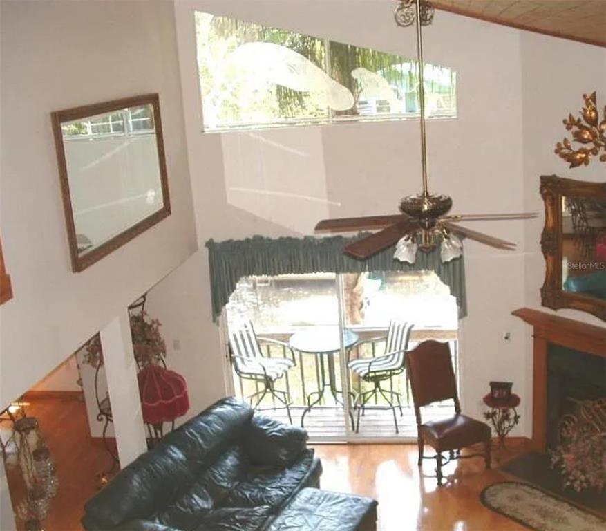 5260 Tuna Lane Weeki Wachee, FL 34607 - Photo 5 of 34 a living room with furniture and a wooden floor
