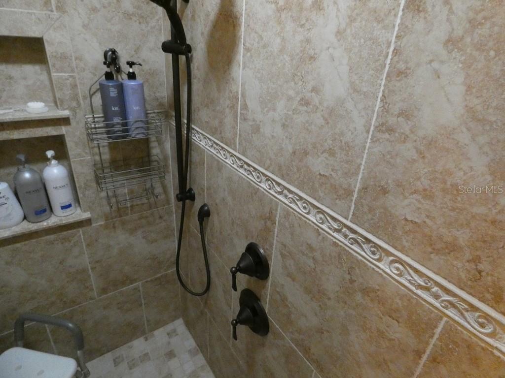 5260 Tuna Lane Weeki Wachee, FL 34607 - Photo 10 of 34 a bathroom with a shower