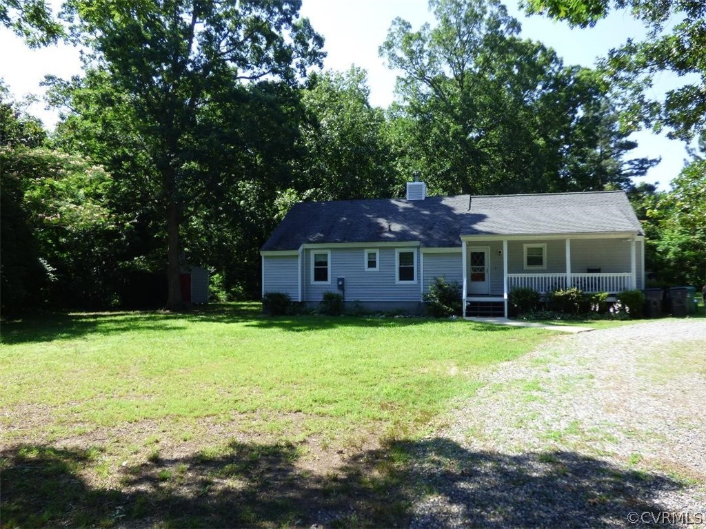 Front of the house with circular driveway and corn