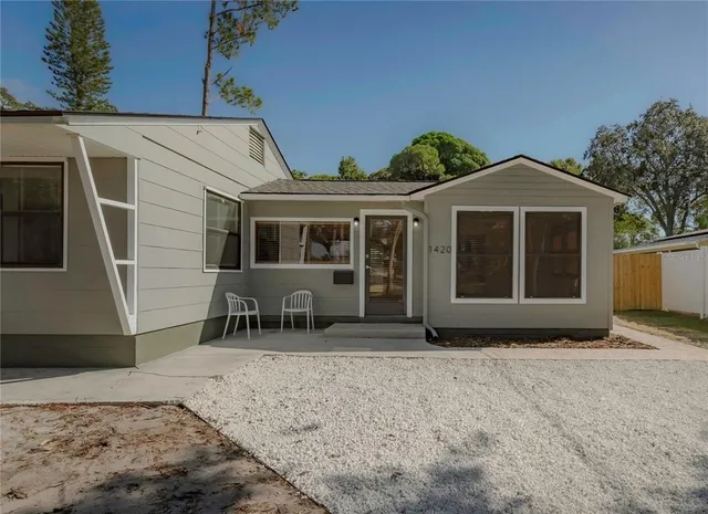 a front view of a house with garden