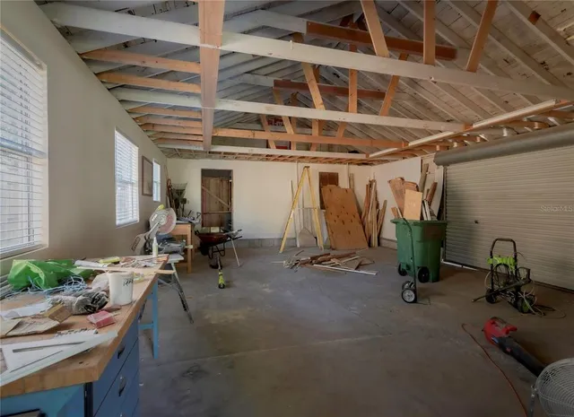 a view of road with large trees