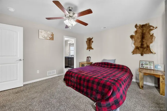 a bedroom with bed and a window