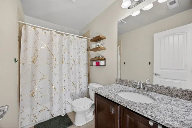 a view of a room with chairs and a wooden floor