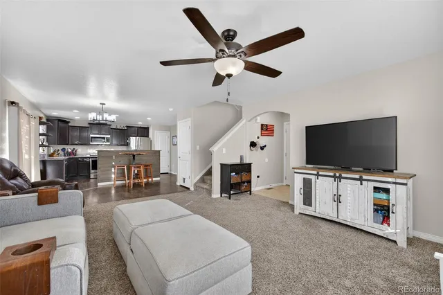 a kitchen with granite countertop a sink and cabinets