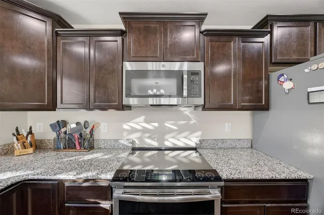 a living room with furniture and stairs