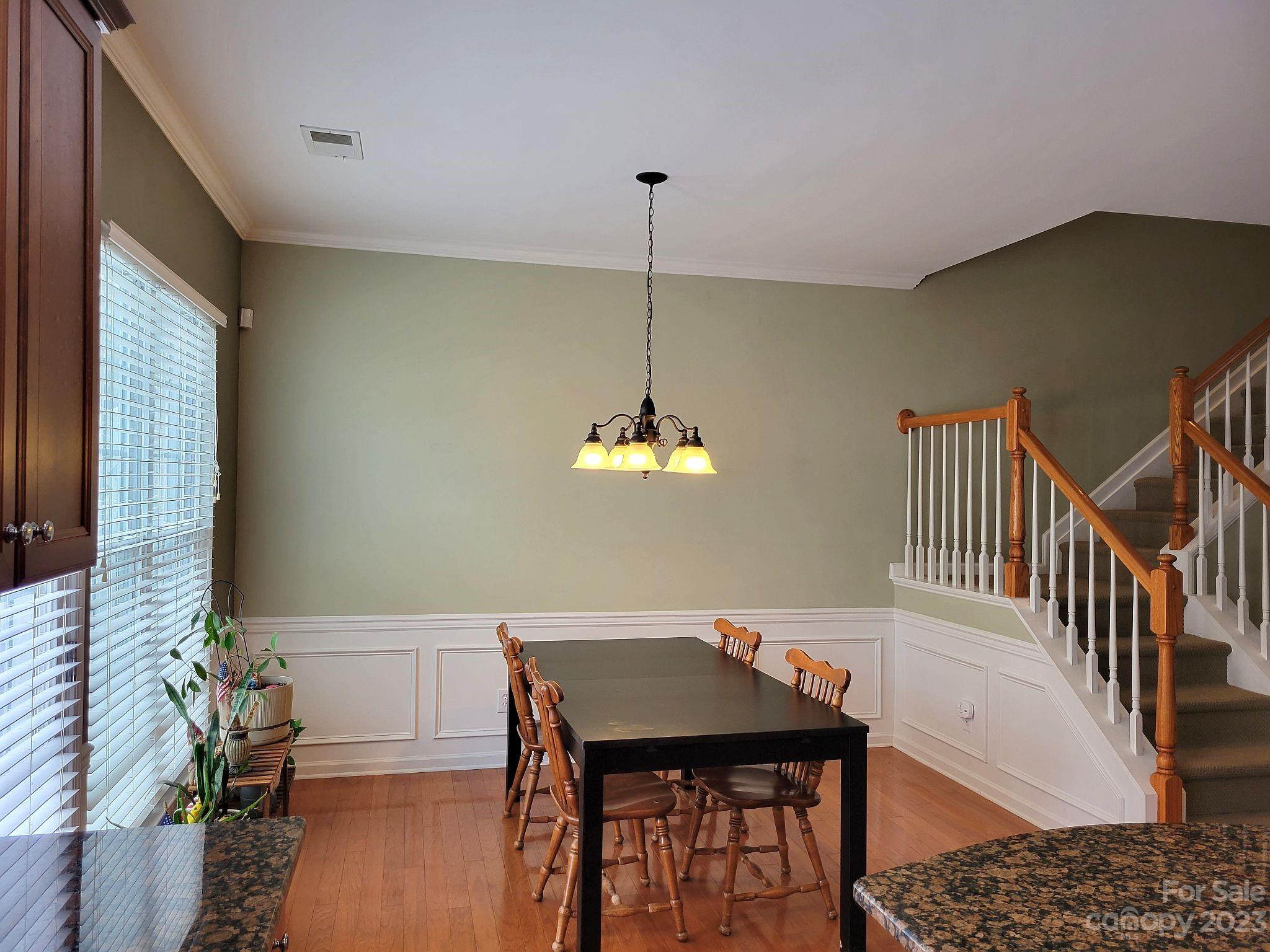 649 6th Baxter Crossing Fort Mill, SC 29708 - Photo 13 of 32 a view of a dining room with furniture window and wooden floor