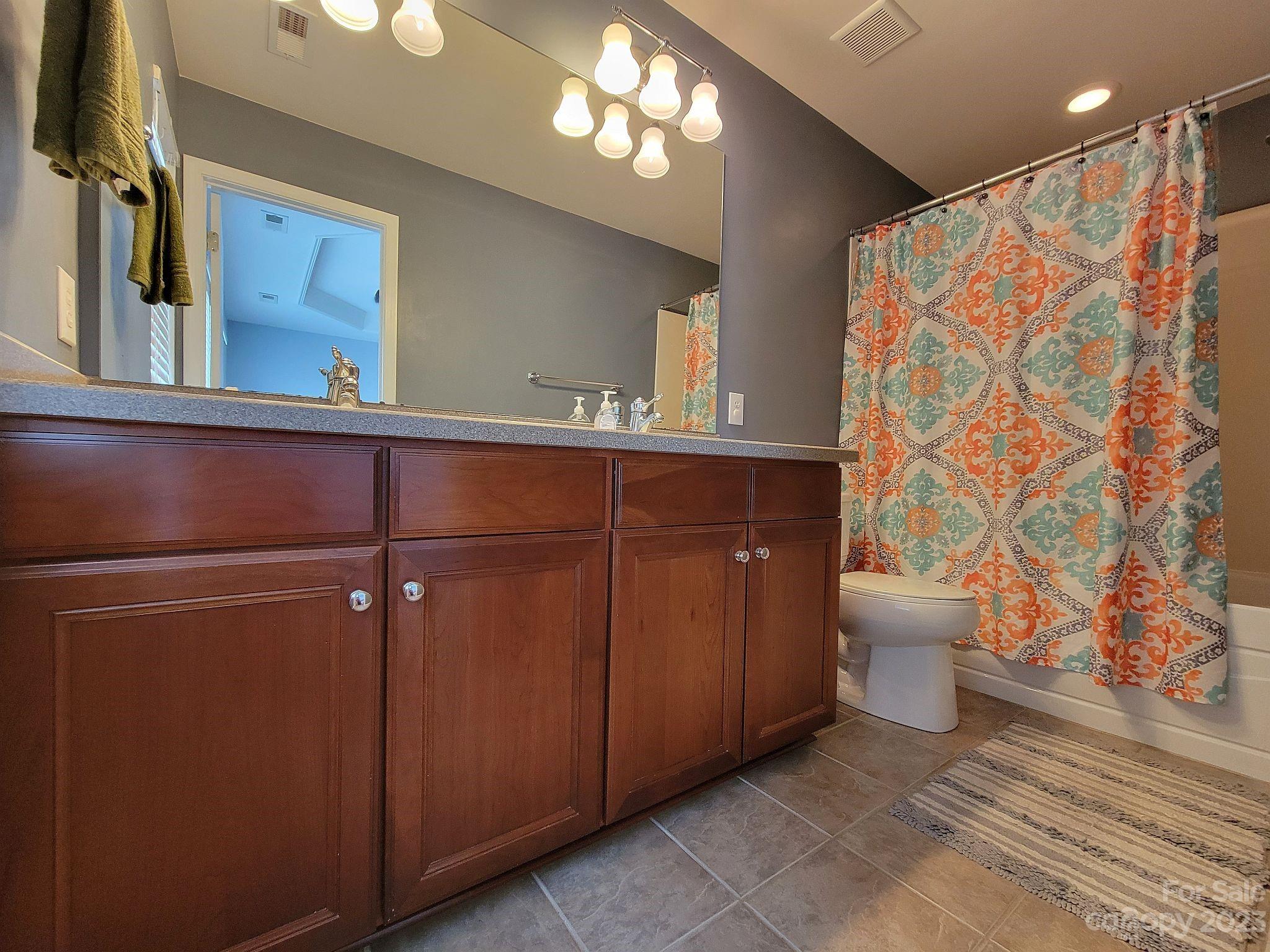 649 6th Baxter Crossing Fort Mill, SC 29708 - Photo 23 of 32 a bathroom with a sink toilet and shower