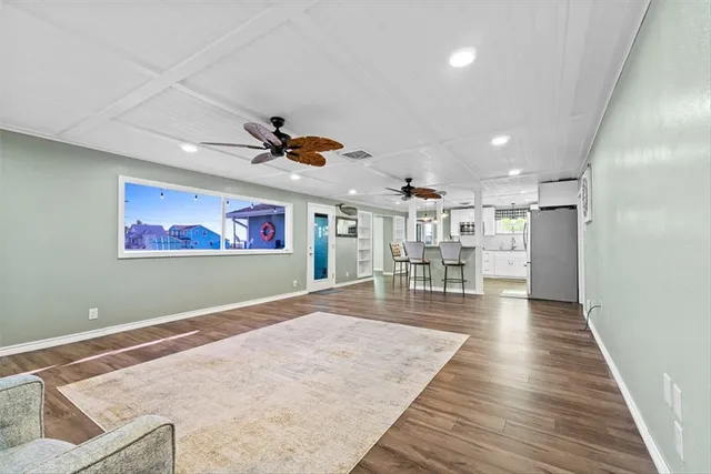 a view of a livingroom with furniture and wooden floor