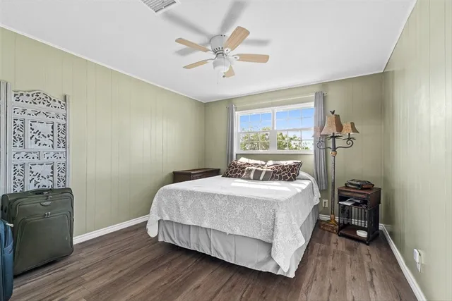 a bedroom with a bed and a table in it