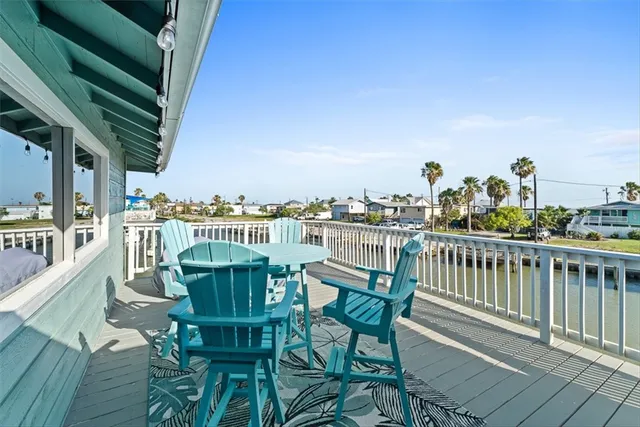 a view of a balcony with chairs