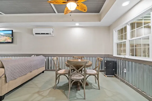 a living room with furniture and a rug