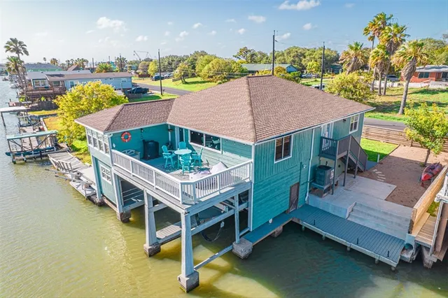 a roof deck with table and chairs