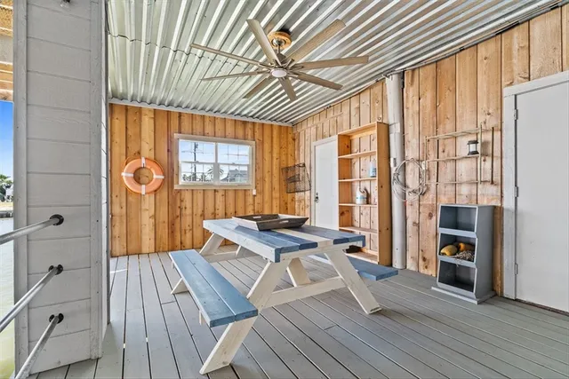 an aerial view of a house yard swimming pool and outdoor seating
