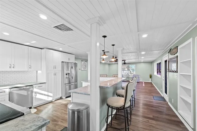 a view of a kitchen and dining room