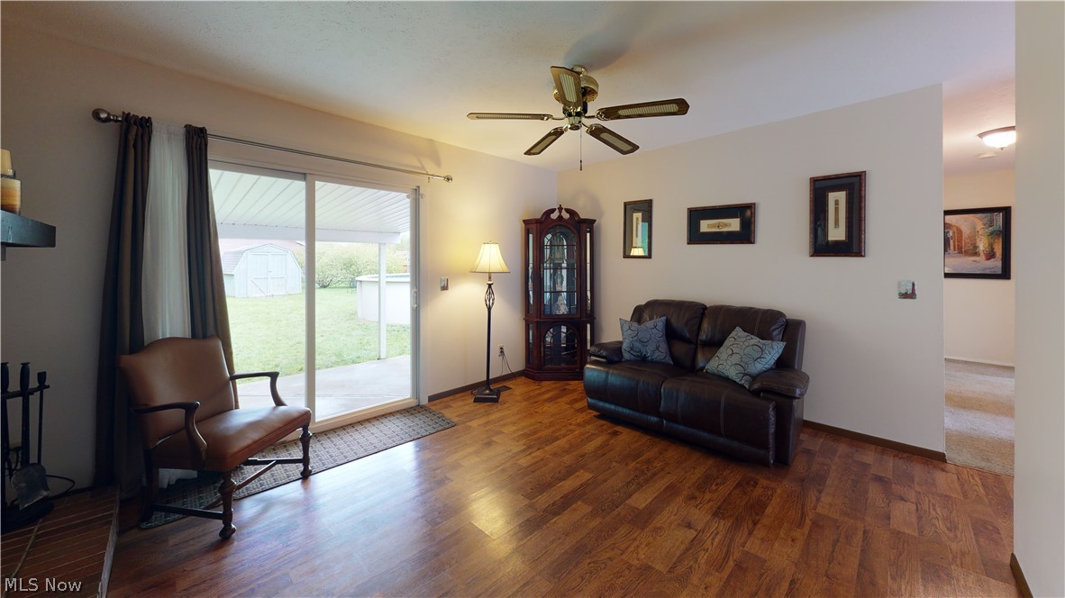 7264 Reynolds Road Mentor, OH 44060 - Photo 6 of 14 Living Room with Fireplace and sliding doors that lead you to cover patio.