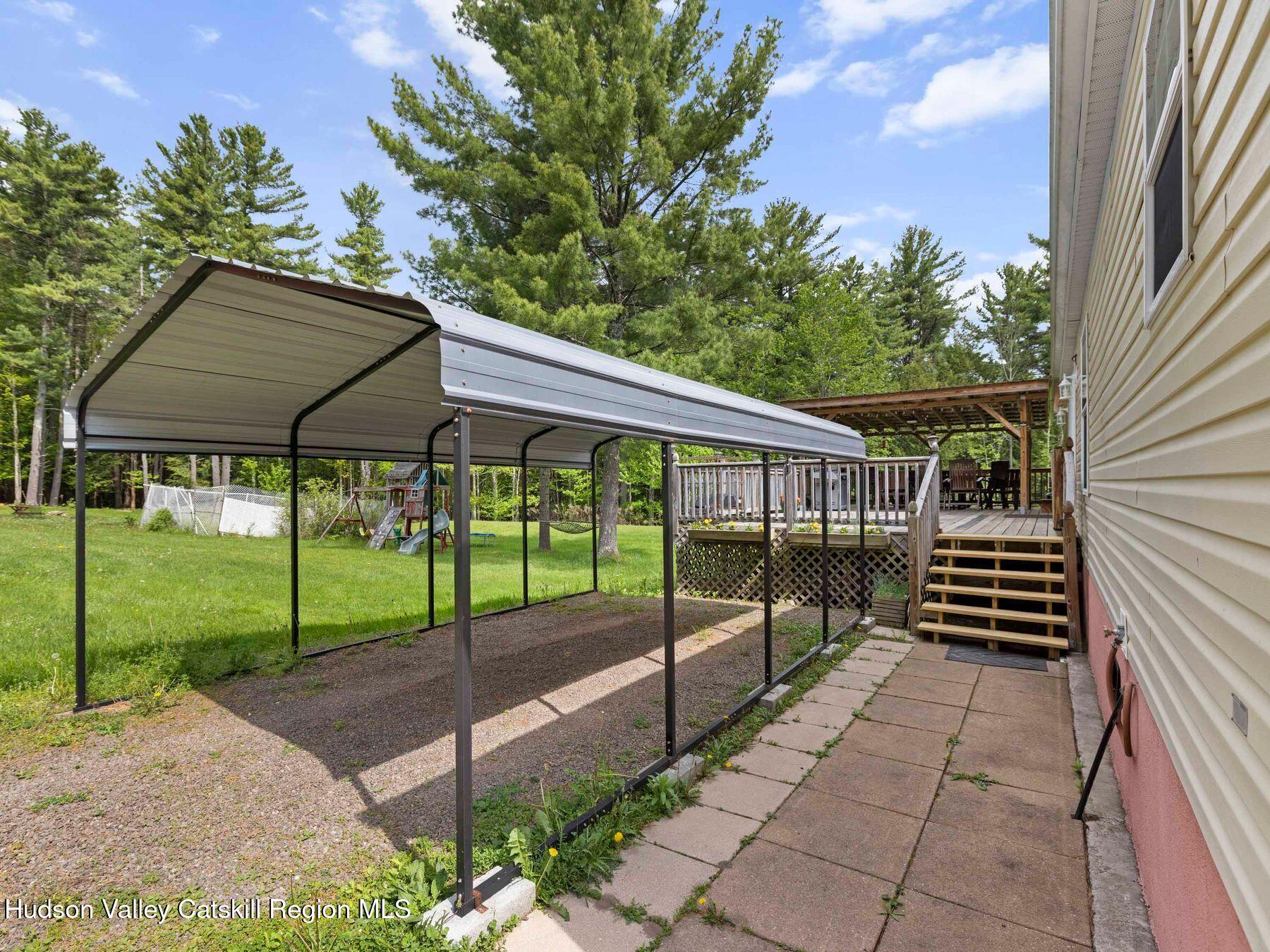 137 Mountain Pond View Road Gilboa, NY 12076 - Photo 4 of 38 a view of a house with backyard and porch