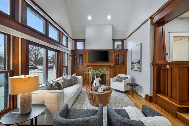 a living room with fireplace furniture and a flat screen tv