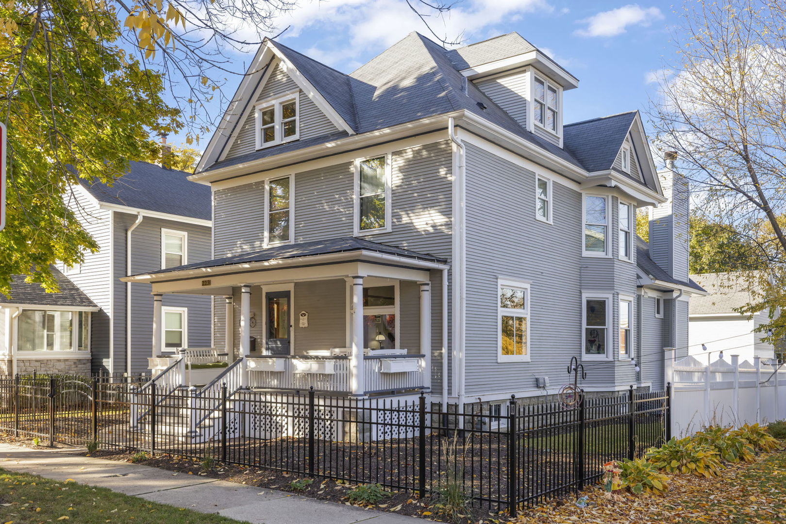 223 North Ellsworth Street Naperville, IL 60540 - Photo 2 of 22 a view of a brick house with many windows