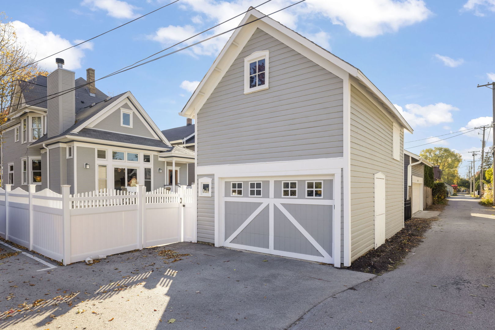 223 North Ellsworth Street Naperville, IL 60540 - Photo 35 of 48 a view of a white house with many windows