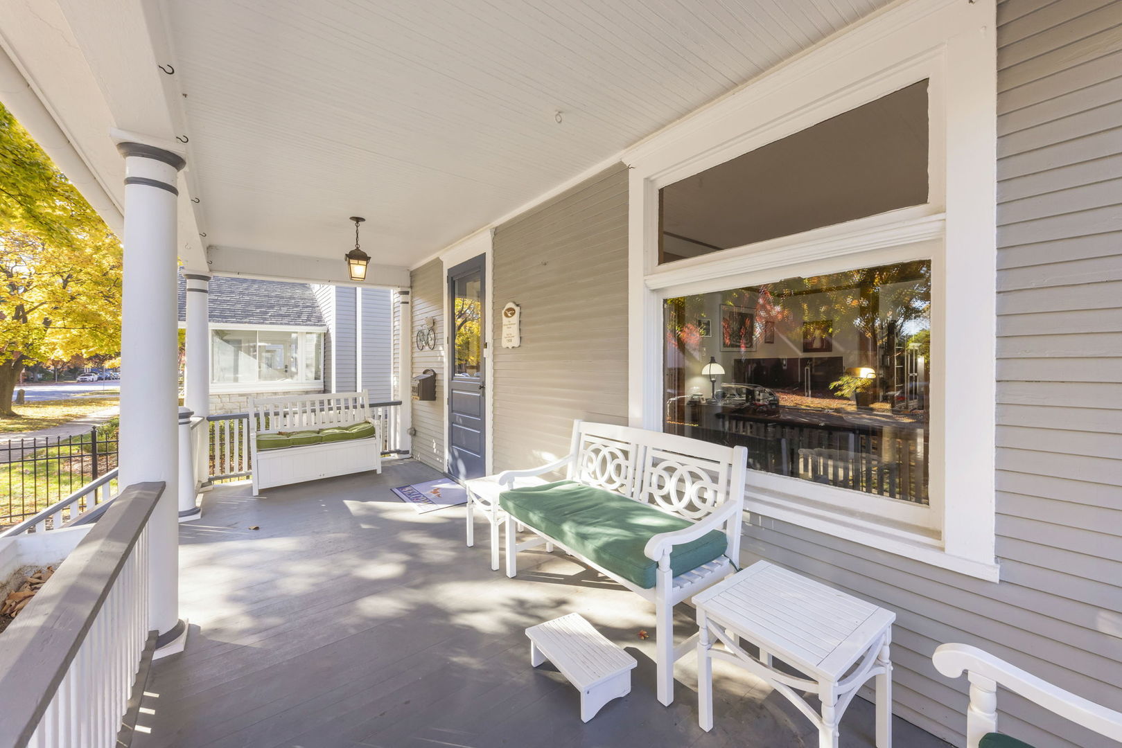 223 North Ellsworth Street Naperville, IL 60540 - Photo 4 of 22 a view of a porch with furniture and floor to ceiling window