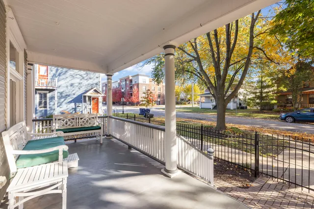 a view of a house with backyard porch and sitting area