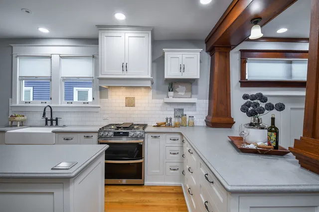 a kitchen with a sink stove and cabinets