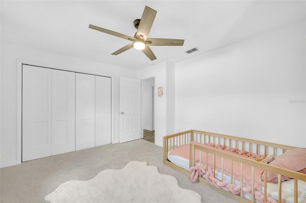 3535 Moores Lake Road Dover, FL 33527 - Photo 32 of 85 Bedroom #3 has a new ceiling fan, new carpet, and a large closet.