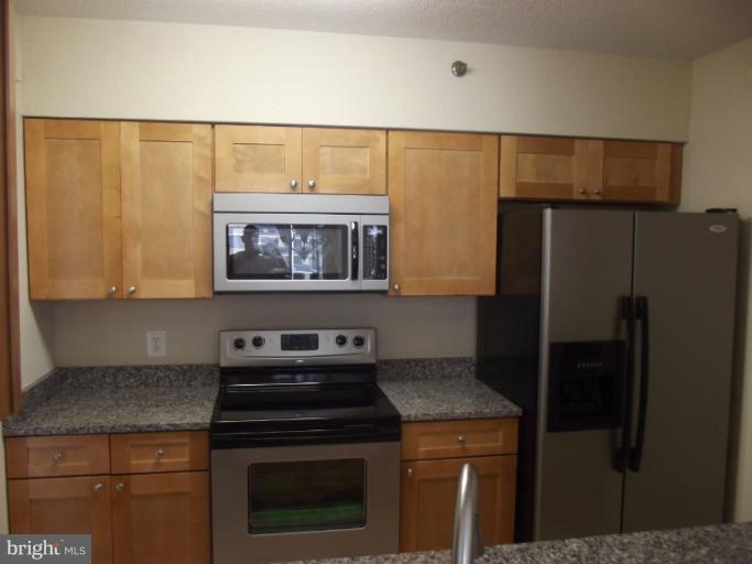 5505 Seminary Road, Unit 802N Falls Church, VA 22041 - Photo 4 of 12 a kitchen with a stove and a refrigerator