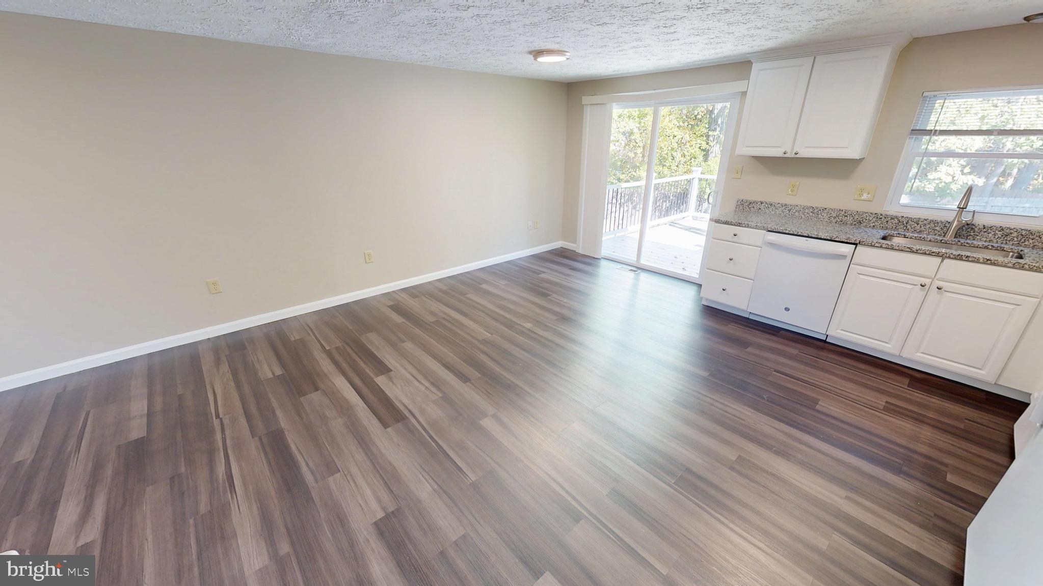 12820 Twin Oak Drive Waldorf, MD 20601 - Photo 11 of 98 a view of a kitchen with wooden floor and a sink