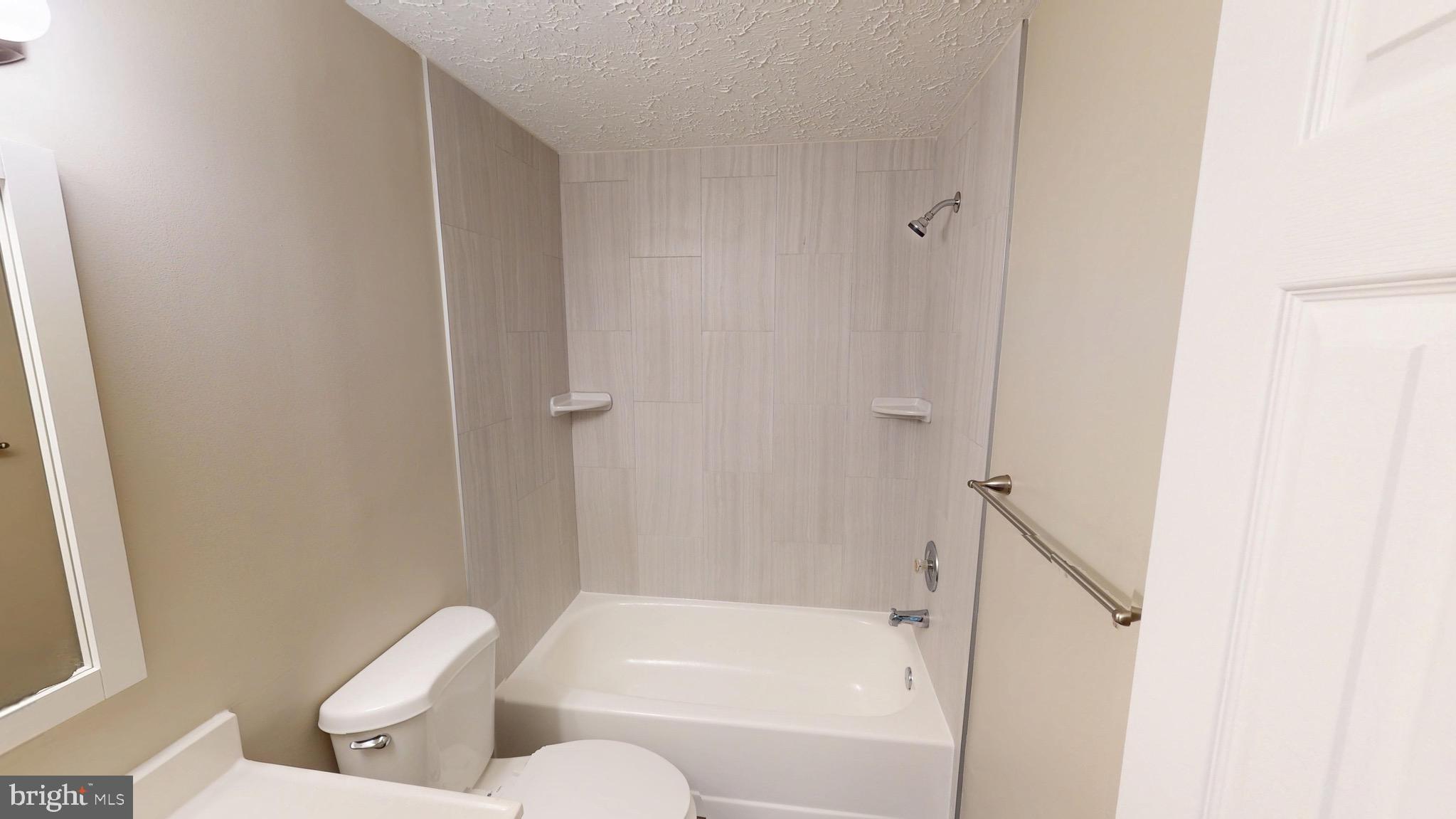 12820 Twin Oak Drive Waldorf, MD 20601 - Photo 40 of 98 a bathroom with a toilet and a bathtub