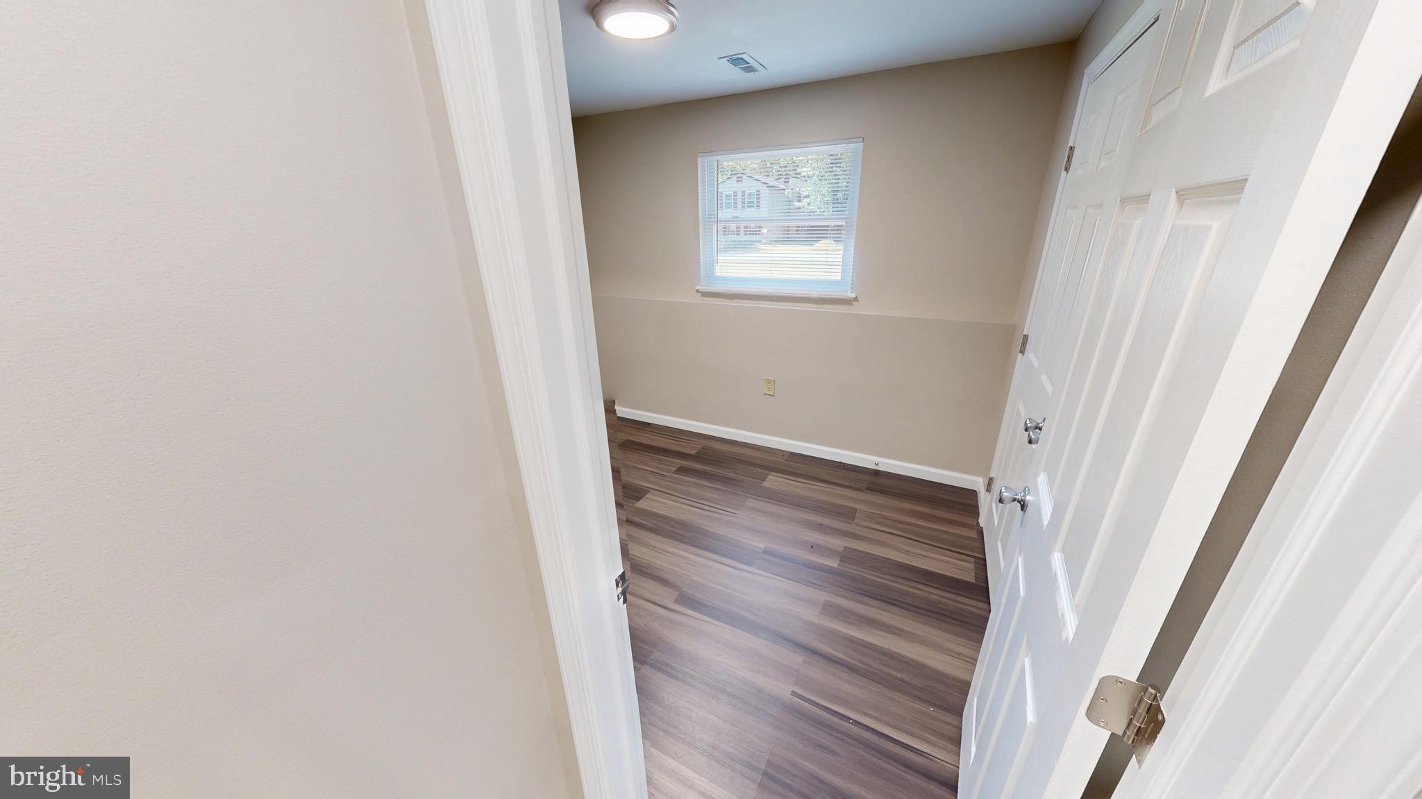 12820 Twin Oak Drive Waldorf, MD 20601 - Photo 45 of 98 a view of a hallway with wooden floor and closet