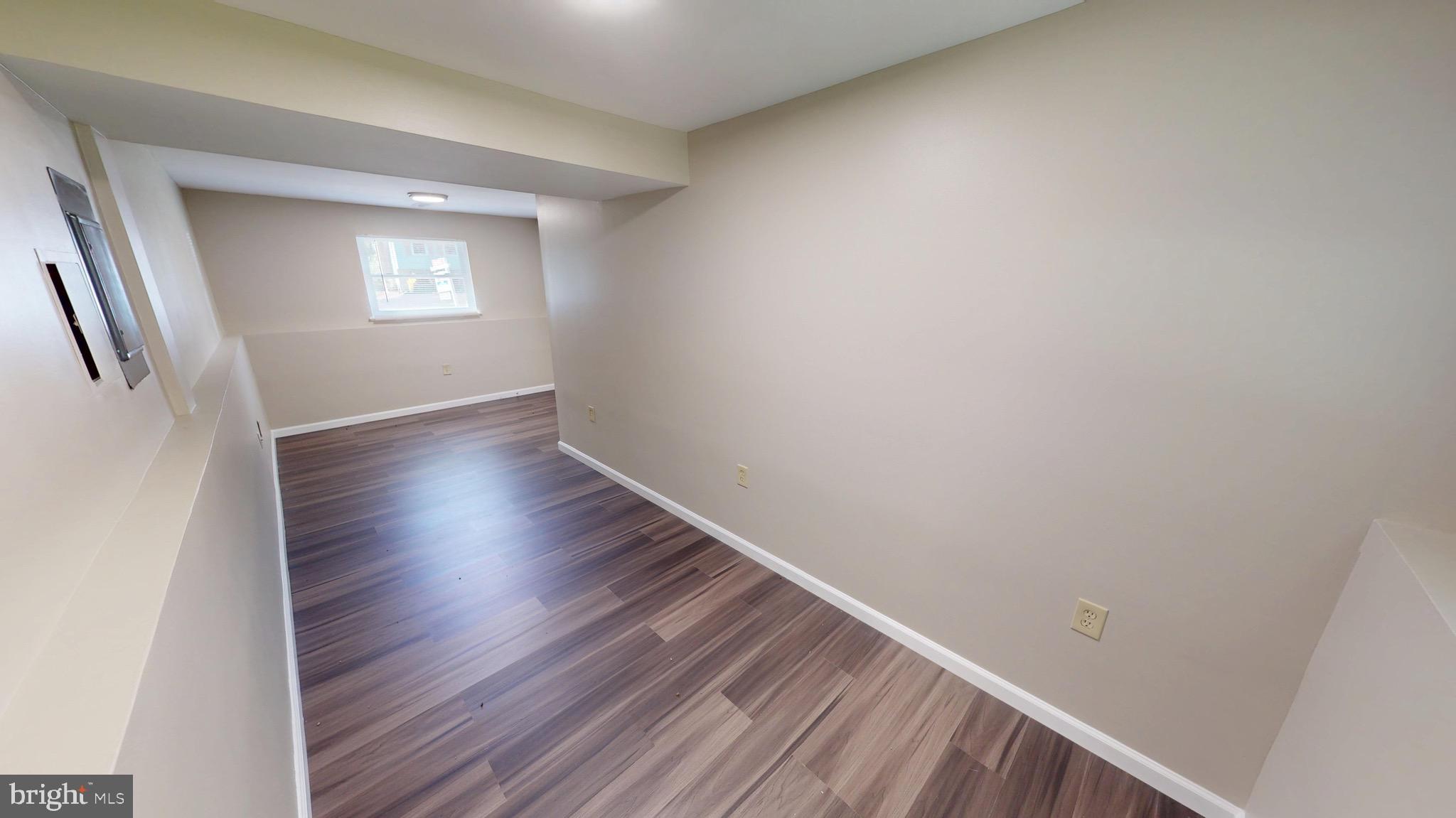 12820 Twin Oak Drive Waldorf, MD 20601 - Photo 49 of 98 a view of an empty room with wooden floor and a window