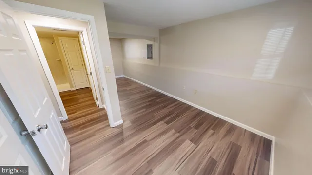 a view of wooden floor in an empty room