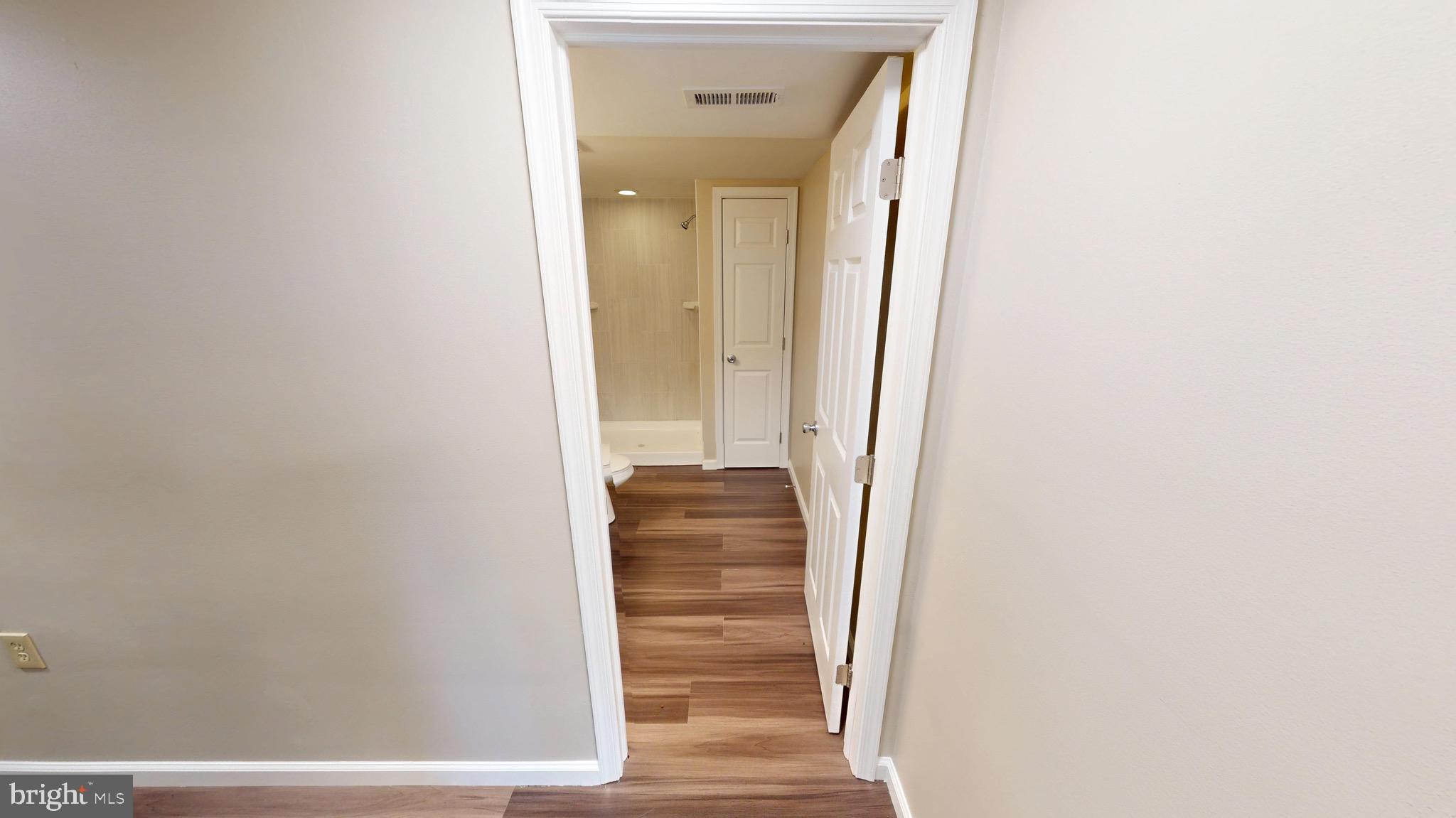 12820 Twin Oak Drive Waldorf, MD 20601 - Photo 52 of 98 a view of walk in closet with wooden floor