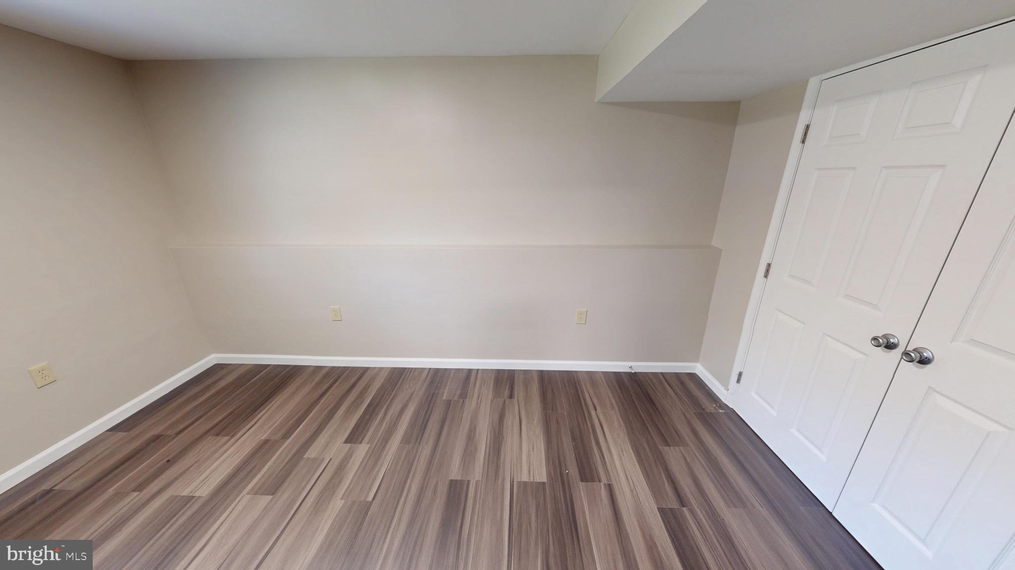 12820 Twin Oak Drive Waldorf, MD 20601 - Photo 61 of 98 a view of an empty room with wooden floor and closet